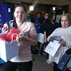 Moms walking out with their WGS gift bag